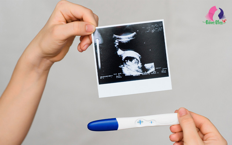 Image of a ultrasound result and a pregnancy test